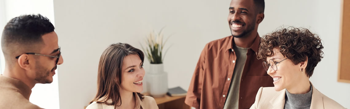 A photo of property owners meetings with an agent and shaking hands.